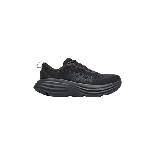 The Hoka W Bondi 8 in Black/Black is an athletic shoe with extended heel geometry for enhanced support, featuring a thick textured sole and bold "HOKA" branding on the side.