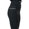 A person in Rohnisch Insulate Wind Shield Tights featuring black high-waisted design, a side zipped pocket, and an elastic drawstring for a snug fit.