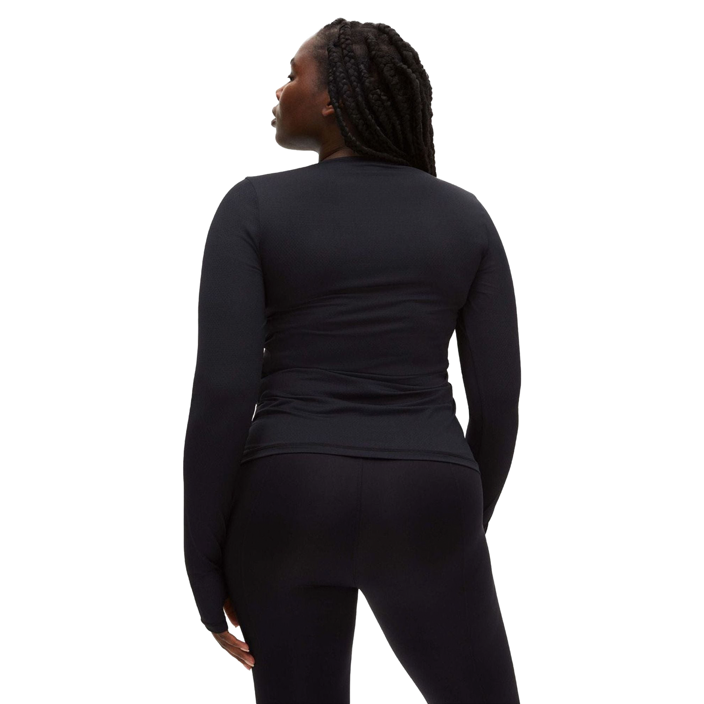 A person with long braided hair wears a fitted Rohnisch Jacquard Long Sleeve Tee, made from moisture-wicking recycled polyester, and black pants, facing away from the camera.