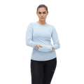 A person in a moisture-wicking light blue Rohnisch Jacquard Long Sleeve Tee and black leggings stands against a plain background.