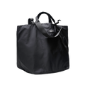 The Large Double Handle Tote by Bags in Progress is a black tote bag with short handles and a long adjustable strap, crafted from woven nylon.