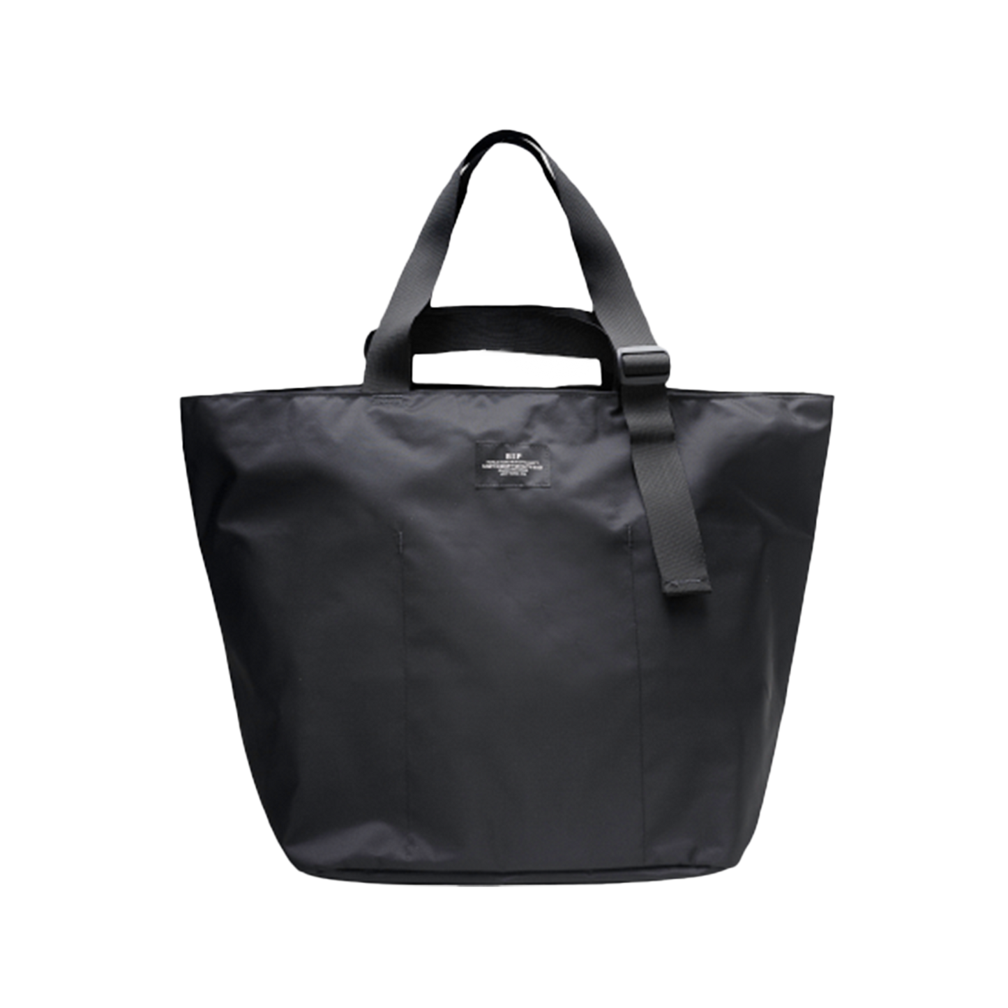 The Large Double Handle Tote by Bags in Progress is a black woven nylon bag with double handles and a detachable shoulder strap, set against a white background.