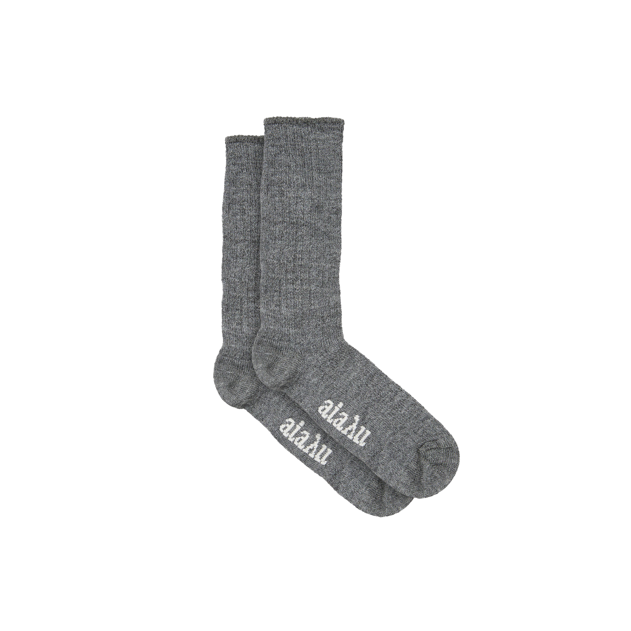 Aiayu's Llama Socks are gray crew socks made from thermoregulating llama wool, featuring "aläku" in white on the soles. Designed for comfort and style, they're perfectly unisex.