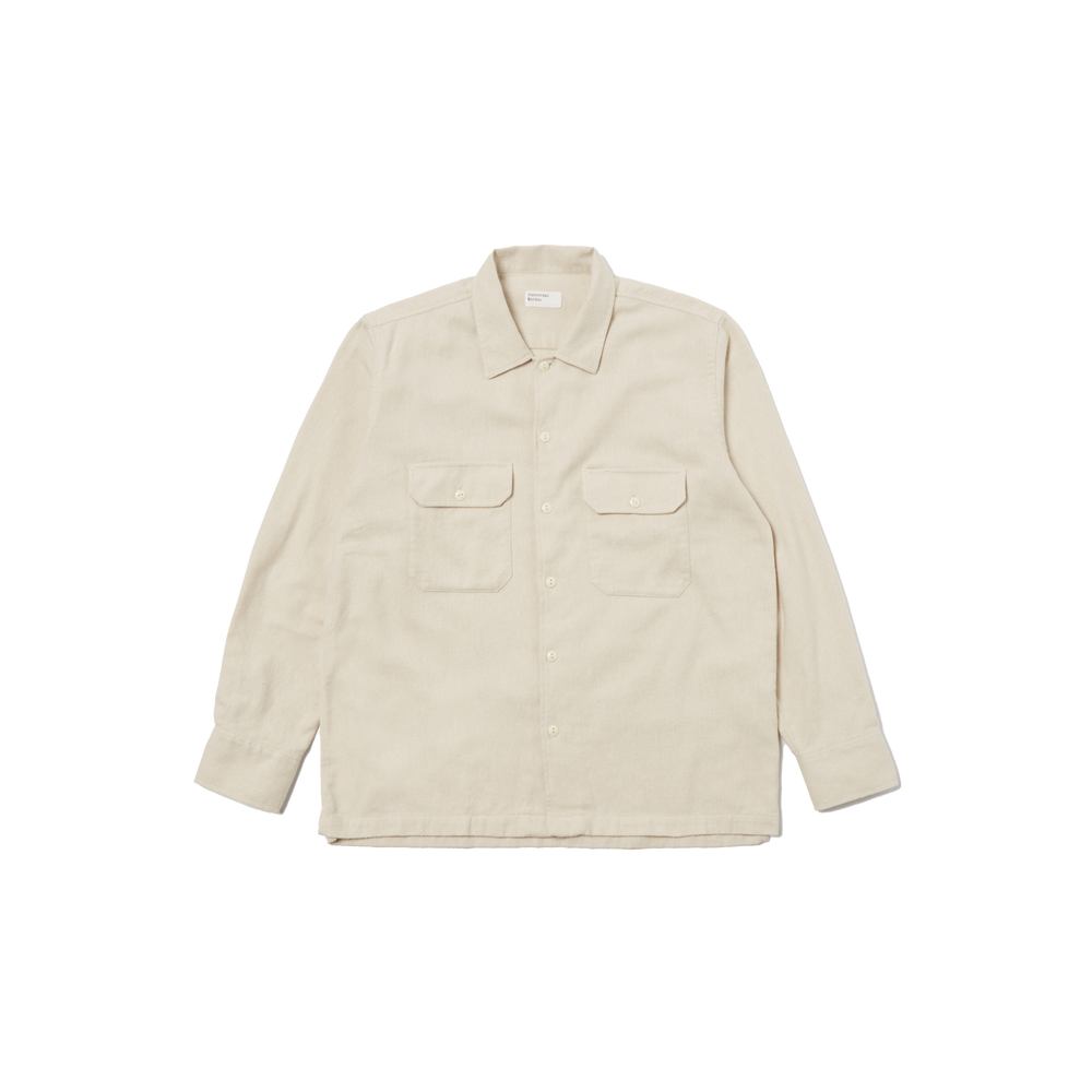 A Universal Works LS Utility Shirt in beige, made from 100% cotton, showcases long sleeves and button flap chest pockets while laid flat against a black background.