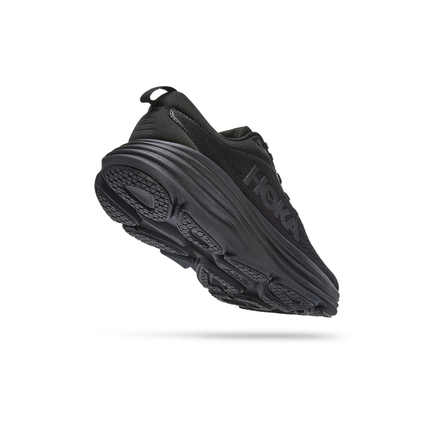 The Hoka W Bondi 9 in Black/Black is shown angled on a white background, featuring thicker, softer foams, an extended heel geometry, a textured tread pattern, and the side logo.