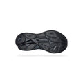 The black rubber outsole of the Hoka W Bondi 9 in Black/Black is shown against a white background, highlighting its textured tread, central “HOKA” branding, extended heel design, and plush foams for superior comfort.