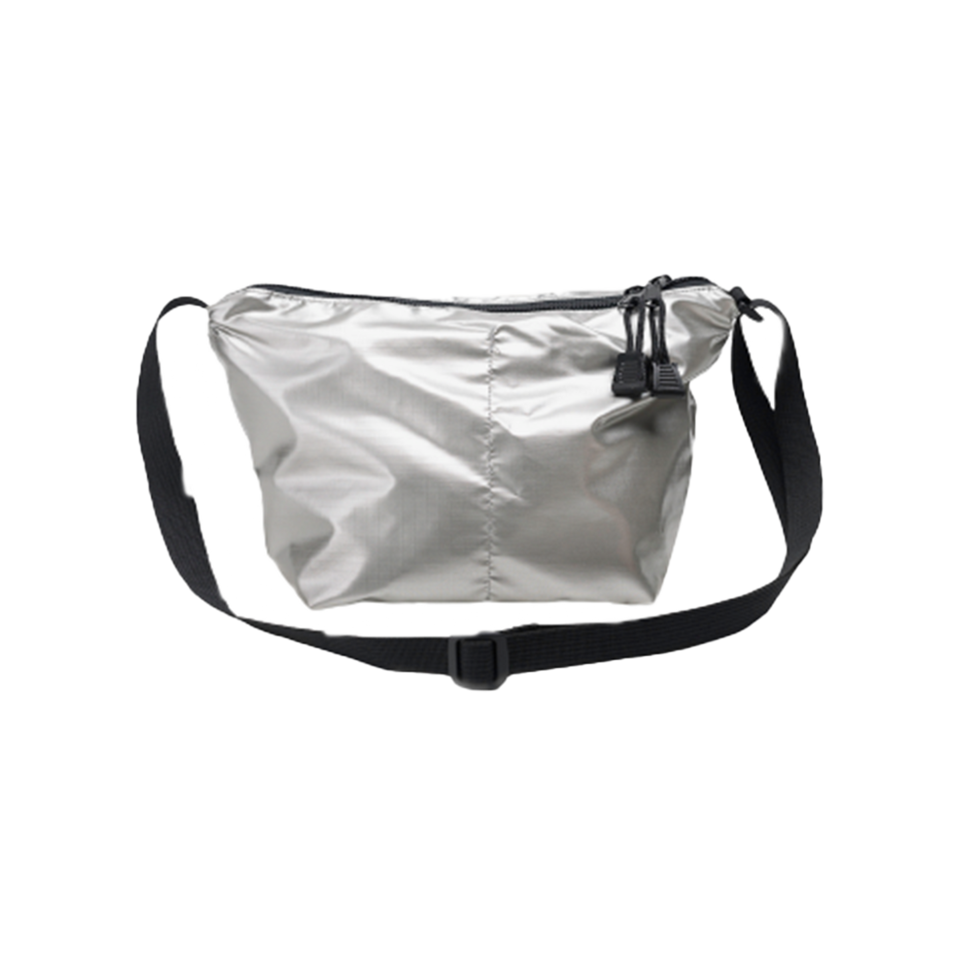 The Micro Tote by Bags in Progress is a sleek silver crossbody bag made from lightweight nylon, featuring a black adjustable strap and zipper closure, set against a black background.