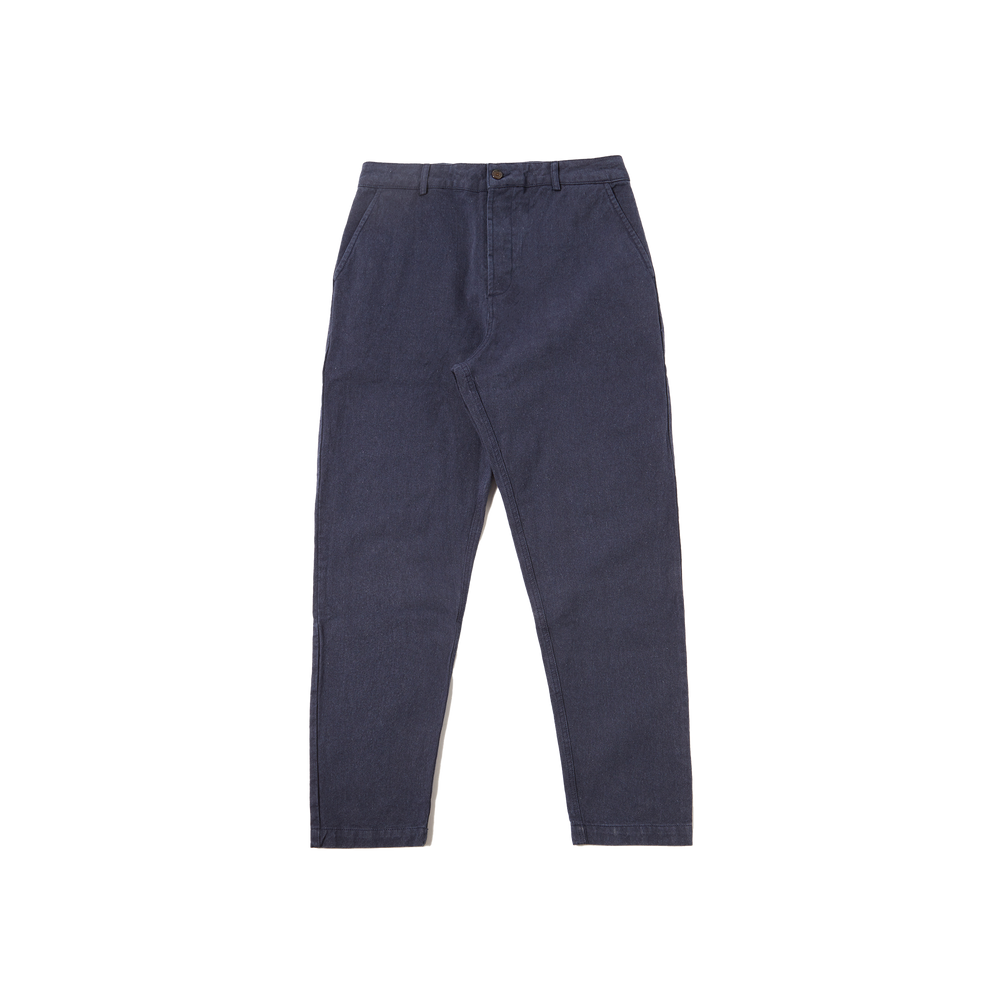 Military Chino pants by Universal Works, made from recycled cotton, laid flat on a white background.