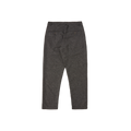 The rear view of the Oxford Pant by Universal Works shows its premium wool craftsmanship and classic tailoring, complete with two back pockets and belt loops, set against a white background.