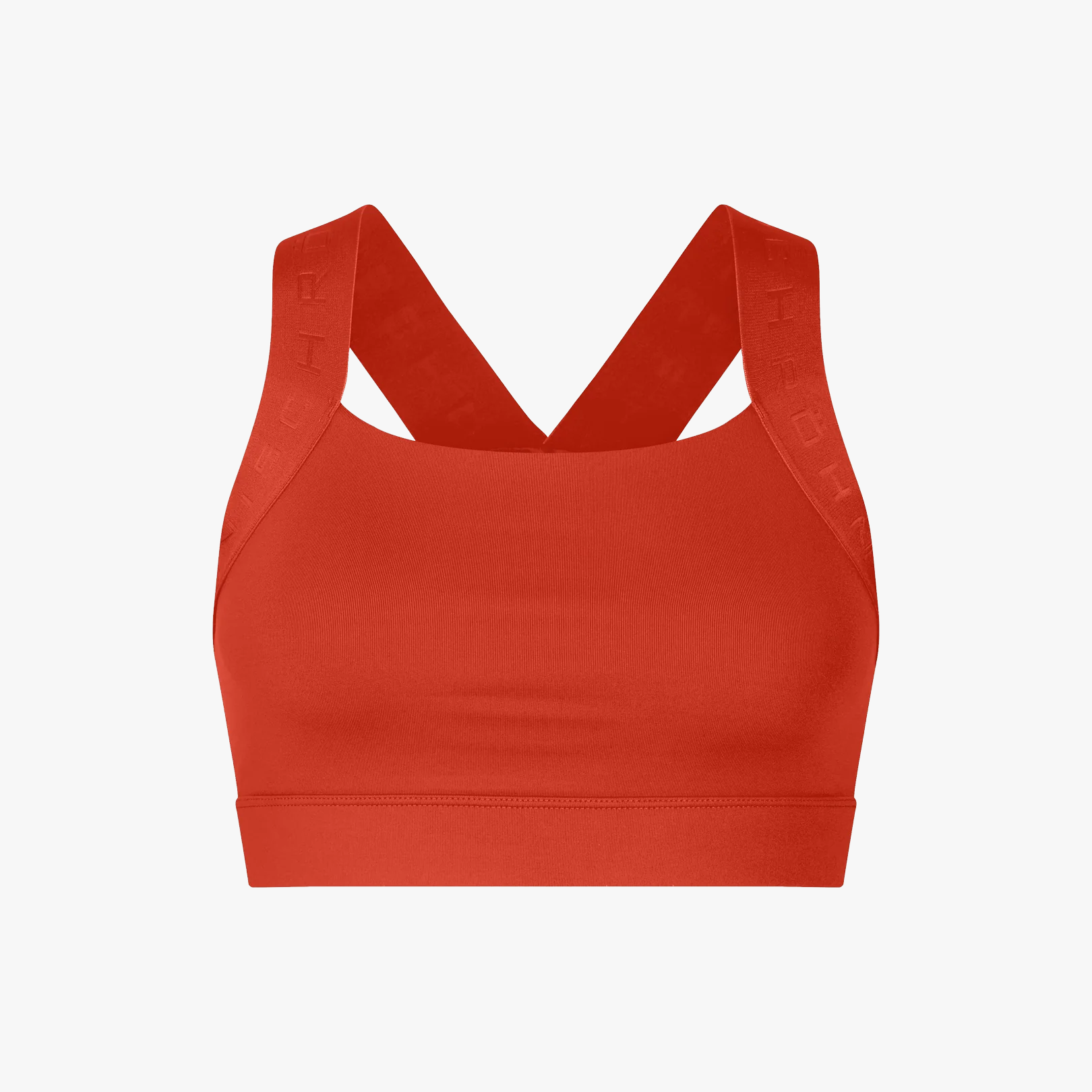 The Rohnisch Kay Sports Bra in red is crafted from recycled polyester, featuring wide straps, a racerback design, and moisture-wicking fabric. Shown against a plain white background.