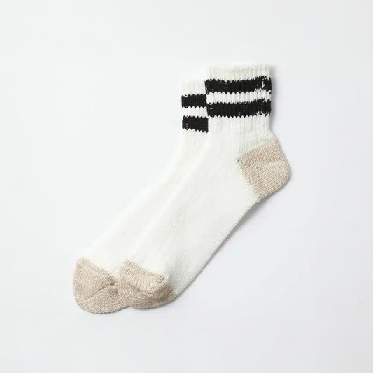 RoToTo's O.S. Ribbed Ankle Socks, in White/Black, feature beige toes and heels plus two black stripes at the top, laid flat on a white background.
