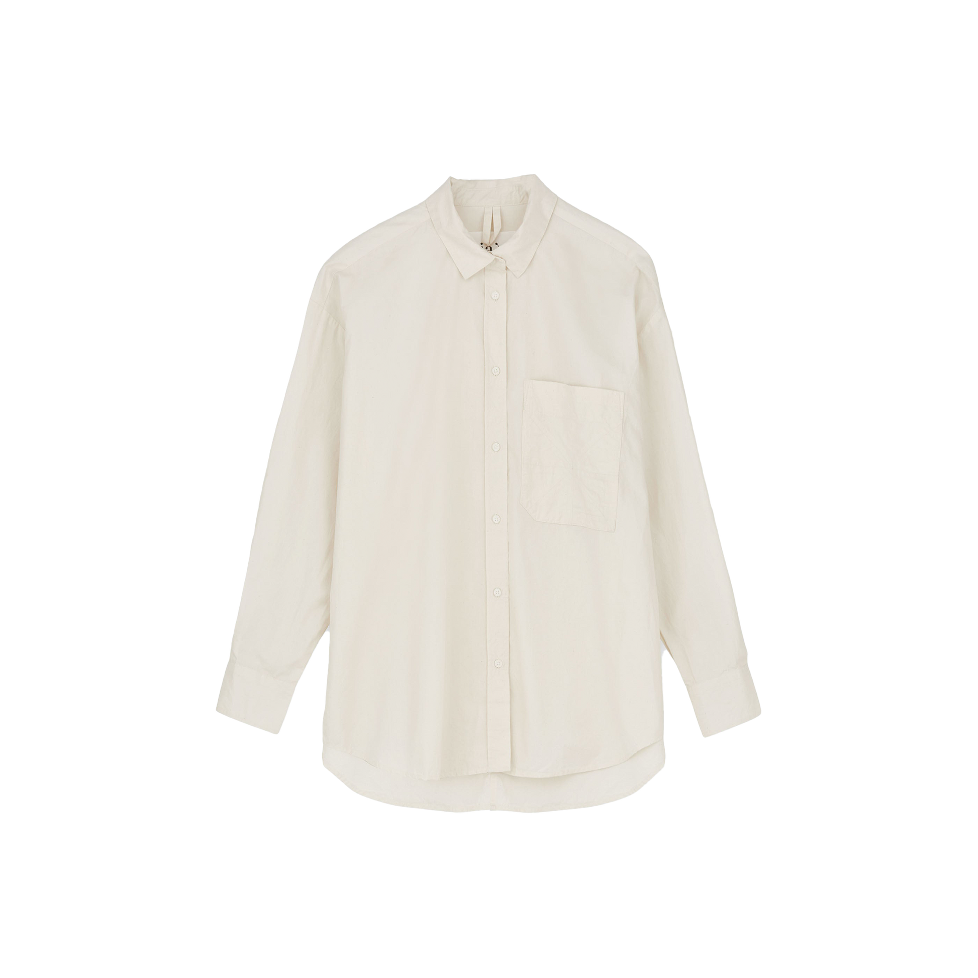 The Aiayu "Shirt Quilt" is an oversized white long-sleeve button-up with a front pocket, crafted from regenerative cotton and displayed against a plain background.