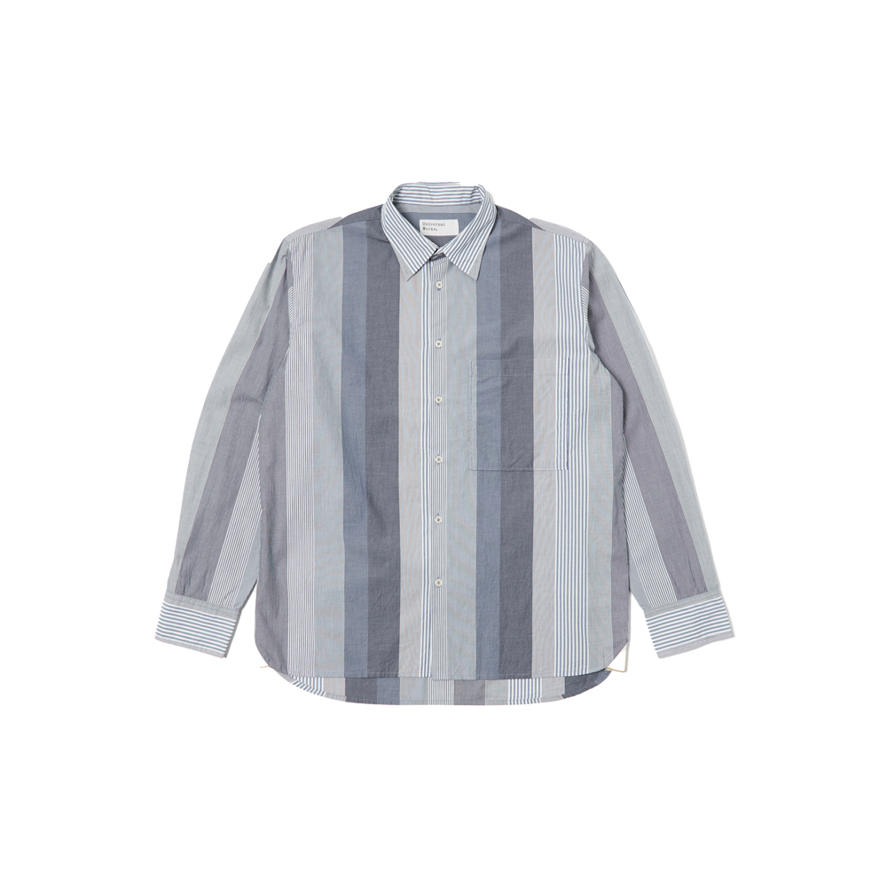The Square Pocket Shirt by Universal Works features a relaxed fit with long sleeves and a contemporary shape, showcasing vertical stripes in shades of blue and gray. Made from 100% cotton, it is displayed against a plain background.