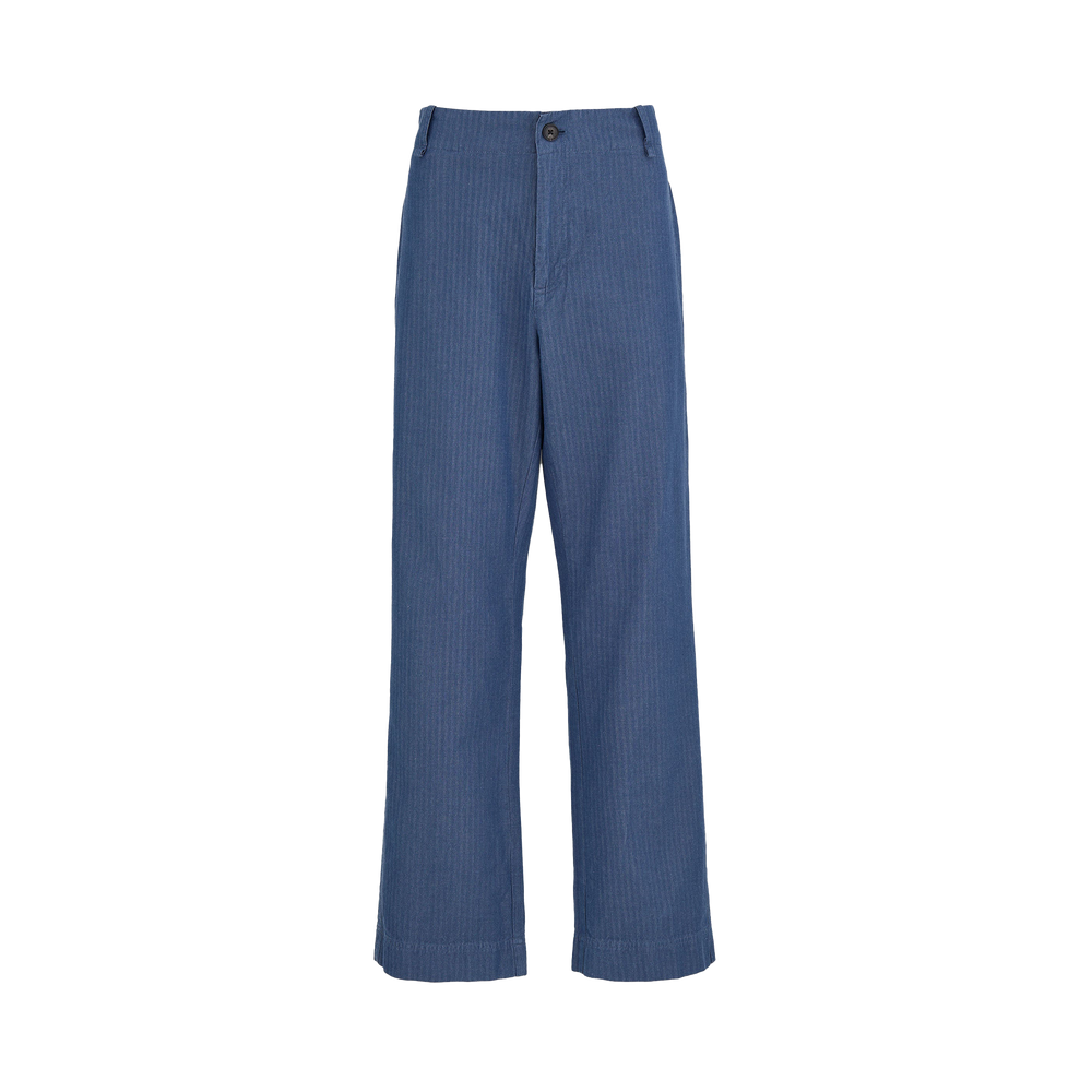 The Willa Pant Herringbone by Aiayu features high-waist blue wide-leg design with button and zip closure, crafted from organic cotton with subtle vertical stripes.
