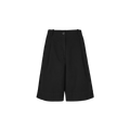 The Willy Shorts by Aiayu are black, knee-length pleated culottes with Bermuda-inspired design, featuring side pockets and wide legs. They offer a button and zipper closure for convenience and are embellished with handmade horn buttons for a distinctive touch.