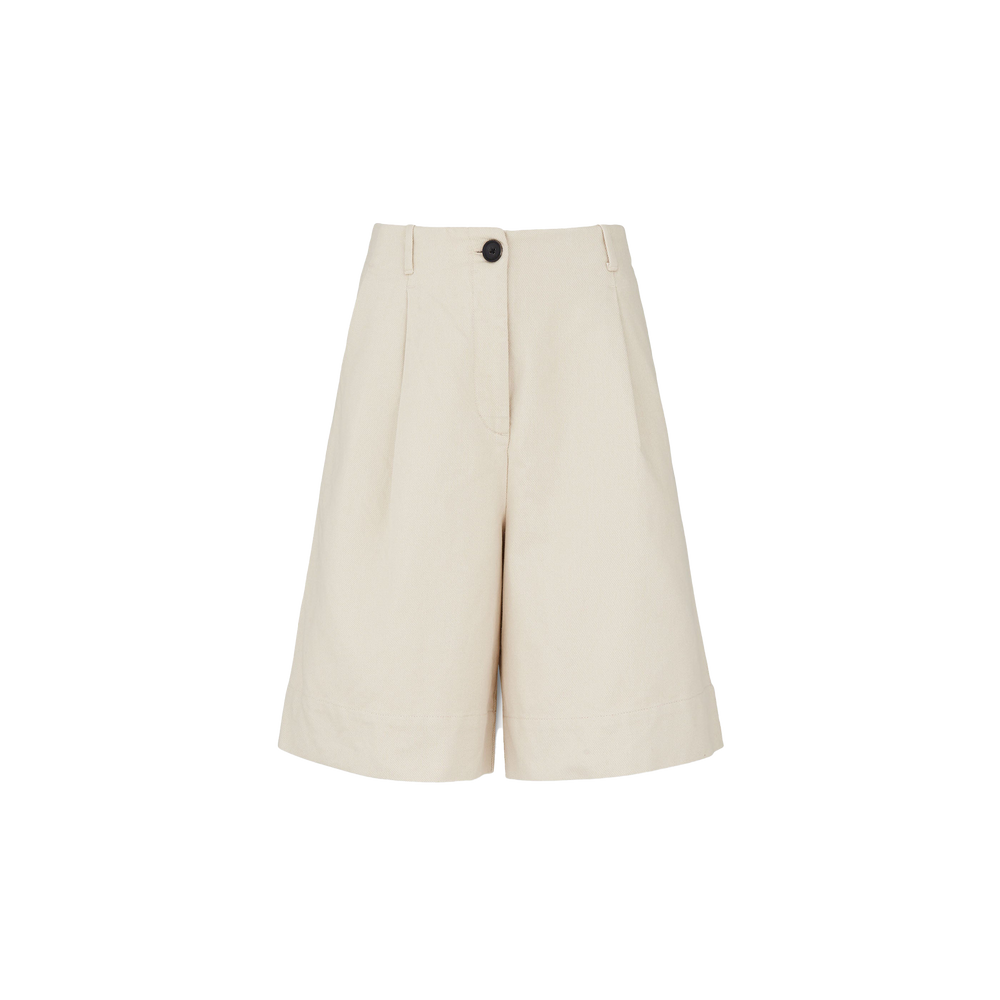 The Willy Shorts by Aiayu are beige, high-waisted, wide-leg bermuda shorts made from sumptuous organic cotton. They feature front pleats, belt loops, and a single black handmade horn button for an artisanal touch.