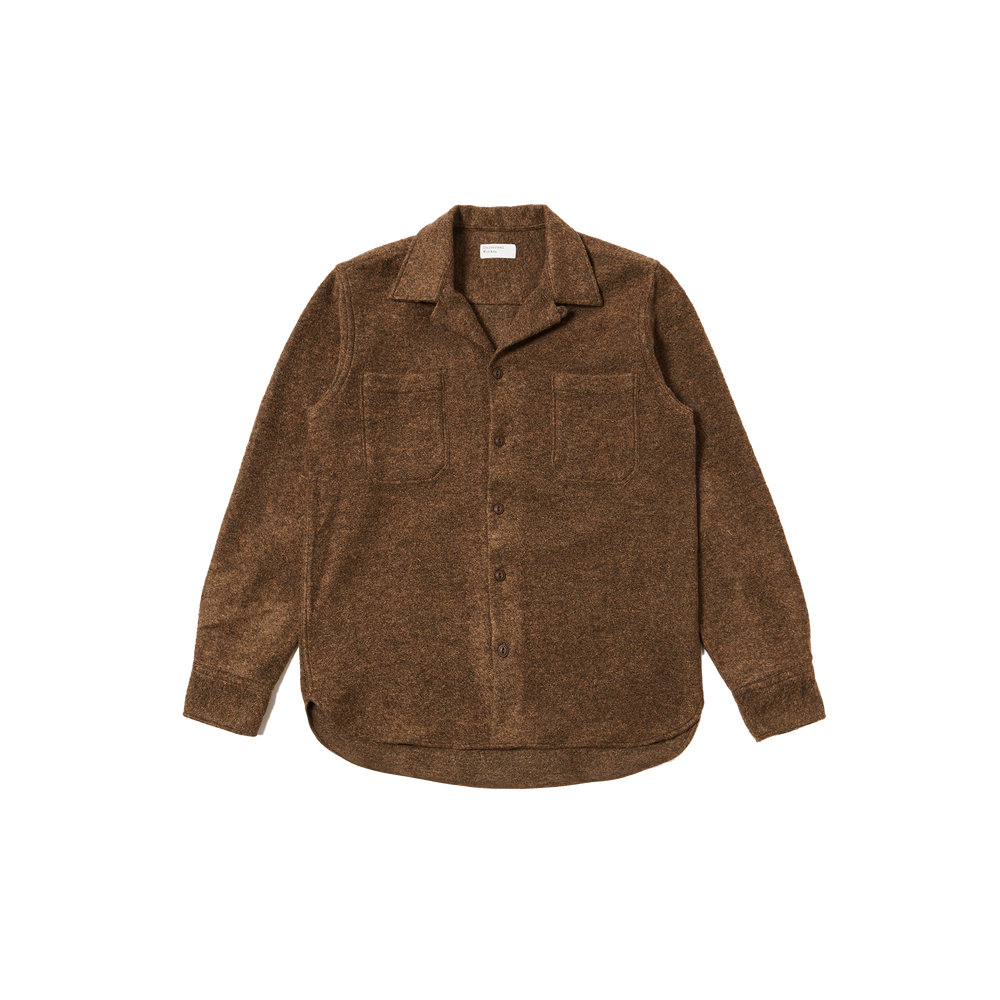 Universal Works' Work Shirt in wool features a brown button-up design with a one-piece collar, long sleeves, and two pockets, laid flat against a white background.